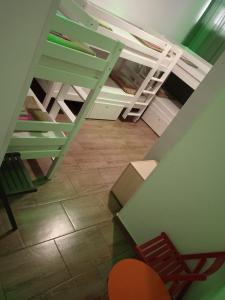 a room with two bunk beds and a chair at Dioklecijan delux in Split