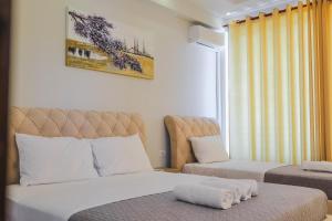 Cama o camas de una habitación en Hotel Milo Ksamil