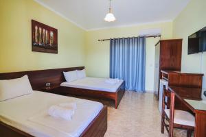 Cama o camas de una habitación en Hotel Milo Ksamil