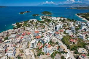 an aerial view of a city next to the ocean at Hotel Milo Ksamil in Ksamil