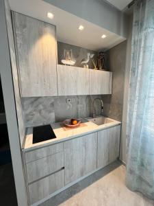 a kitchen with a sink and a counter top at beach house in Chioggia +79 photos
