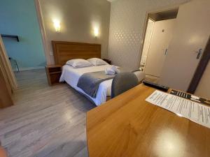 Postel nebo postele na pokoji v ubytování Le Relais De La Place