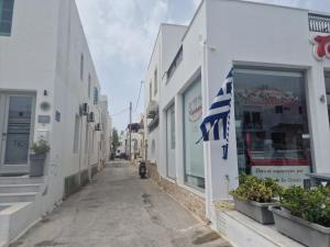 an empty street in a city with buildings at Belva Blue Naxos Stylish, Naxos Town, near Beach in Naxos Chora