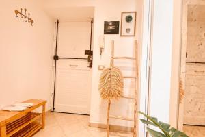 a room with a door and a wooden table at Locazione turistica Davide in Anzio +5 photos