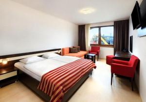 Letto o letti in una camera di Hotel Bešeňová