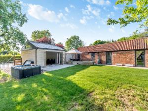 an exterior view of a brick house with a large yard at Red Brick Barn - Uk39916 in Howell