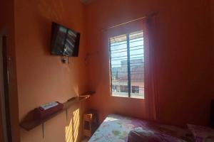 a bedroom with a bed and a window at OYO 92631 Hotel Dan Aula Wahyu Sari B in Karanganyar