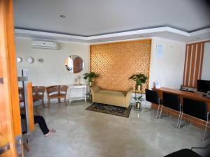 a living room with a couch and a table at OYO Life 92630 Siliwangi Residence 63 in Bandung