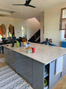 a kitchen with a large island with a counter top at Villa Sealinks City Mui Ne 3br - SeaHome O867,7O7,123 in Phan Thiet