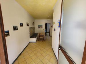 a hallway leading to a room with a table at Mamalù Deluxe in Lampedusa