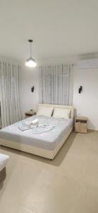 a bedroom with a large bed in a room at Nika Apartments in Ulcinj