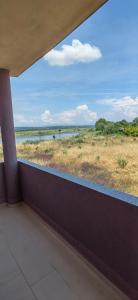 a balcony with a view of the savannah and a river at Nika Apartments in Ulcinj
