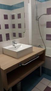 a bathroom with a sink and a shower at LE VALLON DU ROY in Sanary-sur-Mer