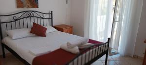 Ένα ή περισσότερα κρεβάτια σε δωμάτιο στο Prapas Apartments 
