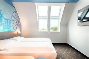Postel nebo postele na pokoji v ubytování B&B Hotel Wien-Meidling
