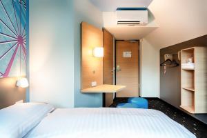 Postel nebo postele na pokoji v ubytování B&B Hotel Wien-Meidling