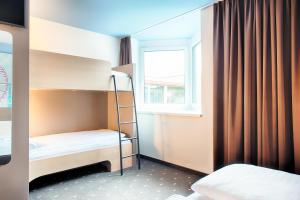 Postel nebo postele na pokoji v ubytování B&B Hotel Wien-Meidling