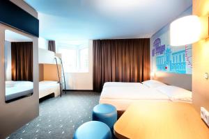 Postel nebo postele na pokoji v ubytování B&B Hotel Wien-Meidling