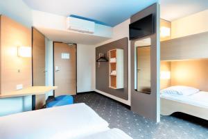 Postel nebo postele na pokoji v ubytování B&B Hotel Wien-Meidling
