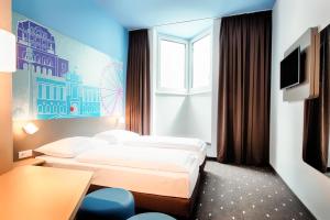 Postel nebo postele na pokoji v ubytování B&B Hotel Wien-Meidling