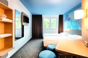 Postel nebo postele na pokoji v ubytování B&B Hotel Wien-Meidling
