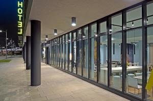 a hallway of a building with large glass windows at B&B Hotel Wien-Hbf in Vienna