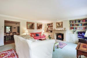 a living room with a couch and a fireplace at The Old Rectory Lodge in Dorchester