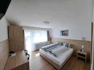 Voodi või voodid majutusasutuse Hotel Posta toas
