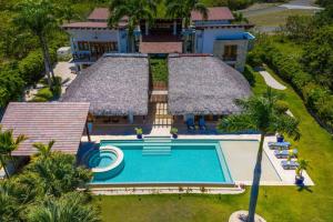 an aerial view of a house with a swimming pool at YARARI 17 PRIVATE RETREAT W POOL JACUZZI MAiD in Punta Cana