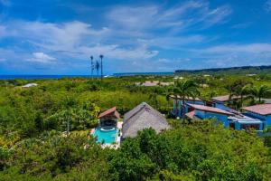 an aerial view of a house with the ocean in the background at YARARI 17 PRIVATE RETREAT W POOL JACUZZI MAiD in Punta Cana