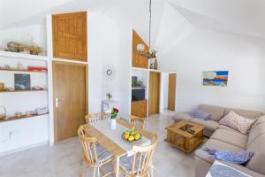 a living room with a table and a couch at Apartment Ina in Rogač