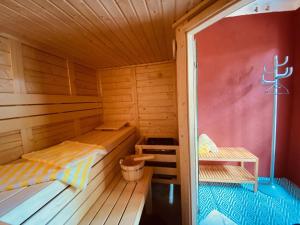 a wooden cabin with two beds in it at Riedhof 2 in Egling