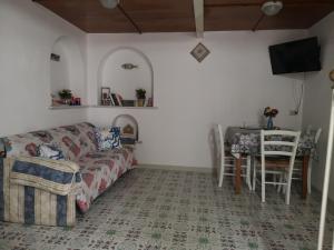 a living room with a couch and a table at Al Limone in Lipari