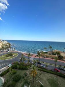 a view of a street and the ocean from a building at First Flatotel International in Benalmádena