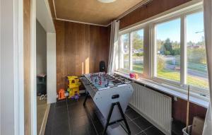 a kitchen with a stove top oven next to a window at 2 Bedroom Cozy Home In Traryd in Traryd
