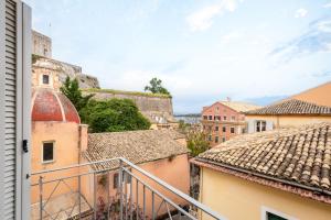 a view of the city from the balcony of a building at Olivia Guest House in Corfu Town