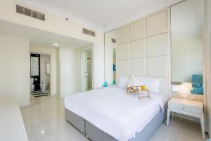 Postel nebo postele na pokoji v ubytování Livbnb - 1 BR at Damac Maison w/ Premier City View