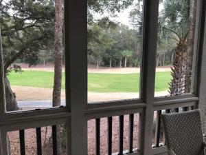 a view of a golf course from a window at 2780 Live Oak Villa in Seabrook Island