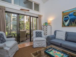 a living room with a couch and two chairs at 2780 Live Oak Villa in Seabrook Island +39 photos