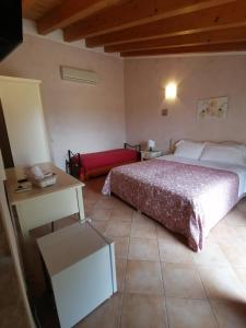 Postel nebo postele na pokoji v ubytování Agriturismo Nuvolino