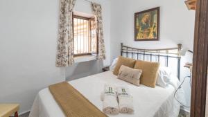 Postel nebo postele na pokoji v ubytování La Yuca Cómpeta by Ruralidays + 31 fotografií