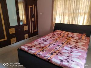 Letto o letti in una camera di His Grace Holiday Home - Nr to Malpe Beach