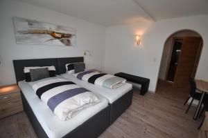 Postel nebo postele na pokoji v ubytování Hotel Martina