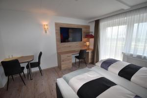 Postel nebo postele na pokoji v ubytování Hotel Martina