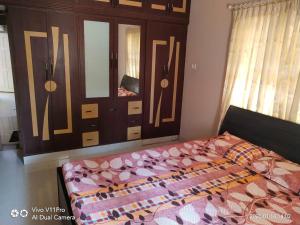 Letto o letti in una camera di His Grace Holiday Home - Nr to Malpe Beach