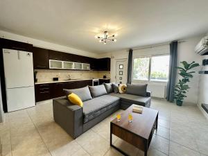 a living room with a couch and a table at Mylos Ηome in Ierapetra