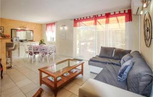 a living room with a couch and a table at Le Mas Des Collines in Rousset-les-Vignes