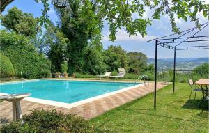 a swimming pool in the yard of a house at Villa Marianna in Lugnano