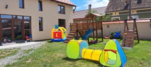 a playground in the yard of a house at Porumbacu381 - Casa de Oaspeti Faini in Porumbacu de Sus