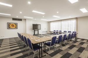 a conference room with a large table and chairs at Quest Nowra in Nowra